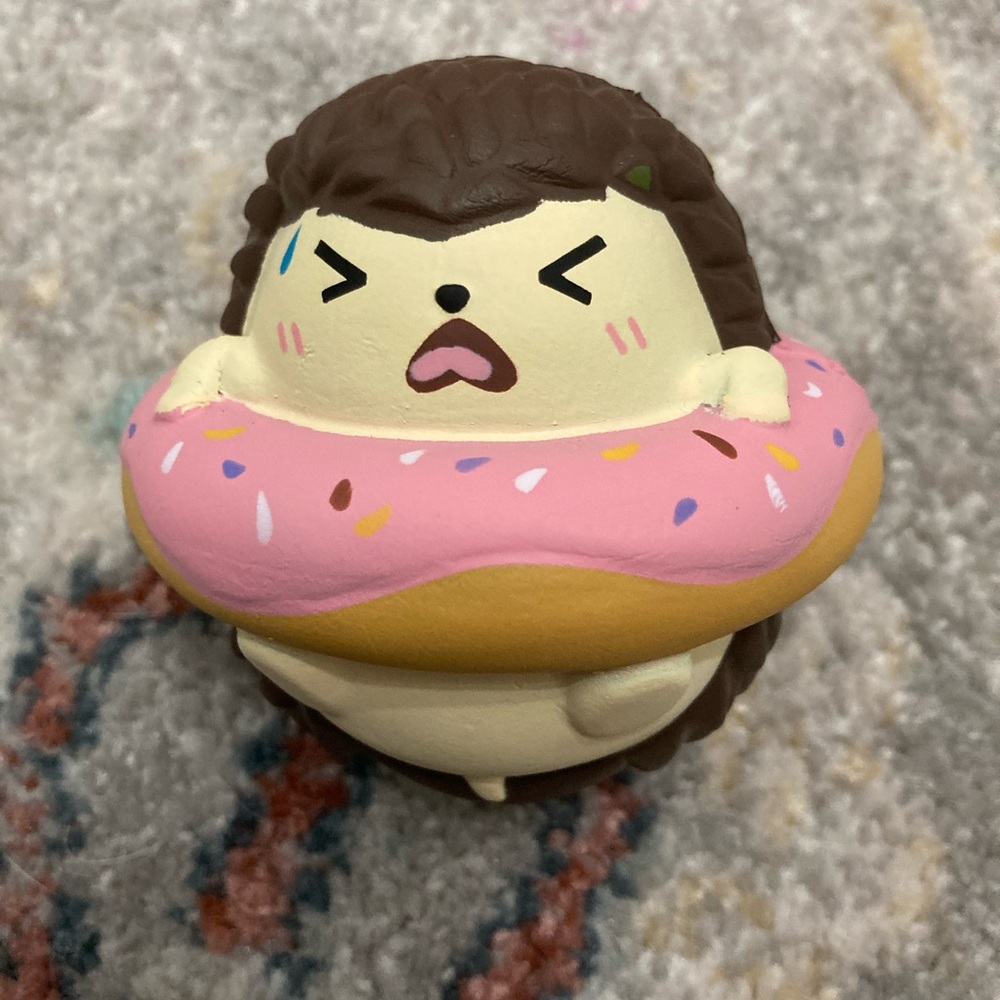 Cutie creative fluff fluff hedgehog in a donut
